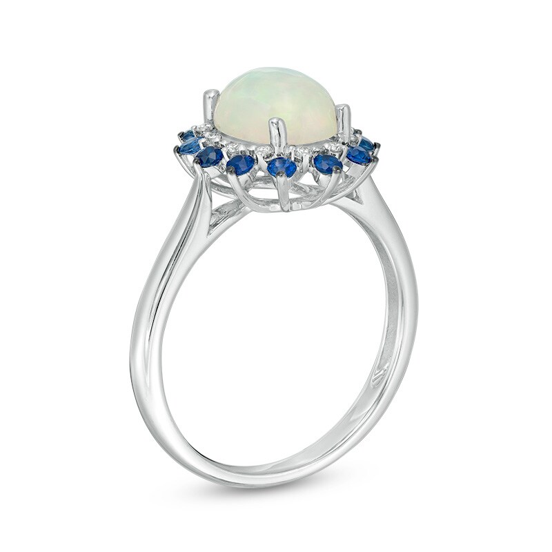 Previously Owned - Oval Opal, Blue Sapphire and 1/15 CT. T.W. Diamond Double Sunburst Frame Ring in 10K White Gold