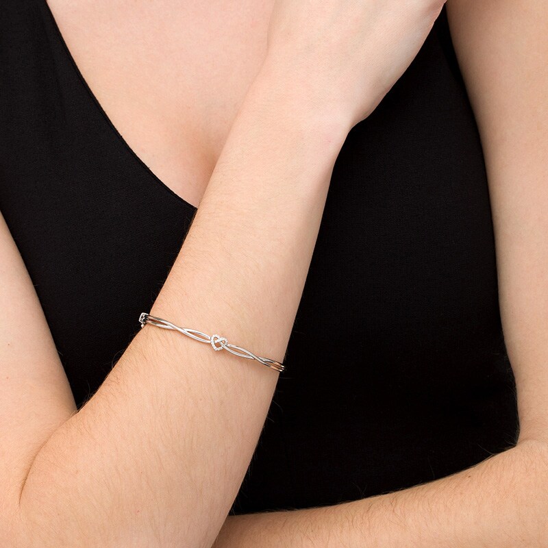 Main Image 2 of Previously Owned - 1/10 CT. T.W. Diamond Heart Knot Bangle in Sterling Silver
