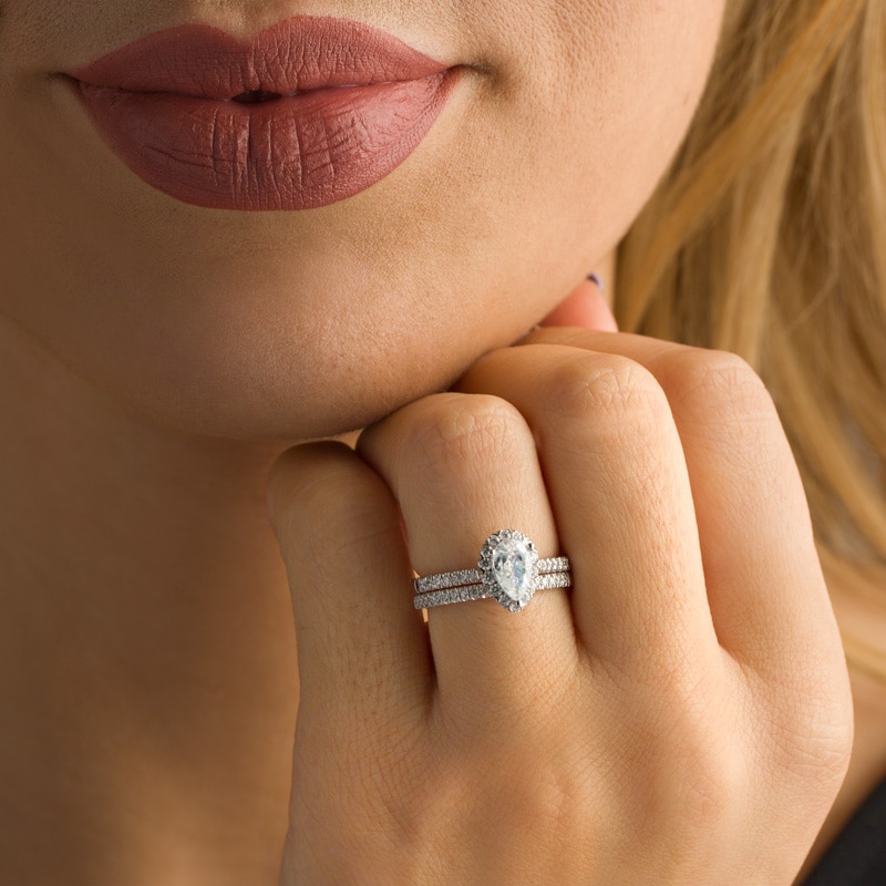 Previously Owned - 1-1/5 CT. T.W. Pear-Shaped Diamond Frame Bridal Set in 14K White Gold (I/SI2)