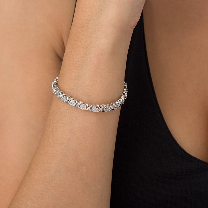 Previously Owned - 1/2 CT. T.W. Composite Diamond "XO" Bracelet in Sterling Silver - 7.25"