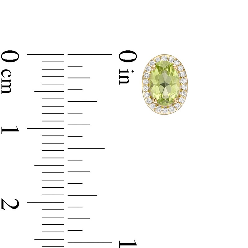Previously Owned - Oval Peridot and 1/10 CT. T.W. Diamond Frame Stud Earrings in 10K Gold