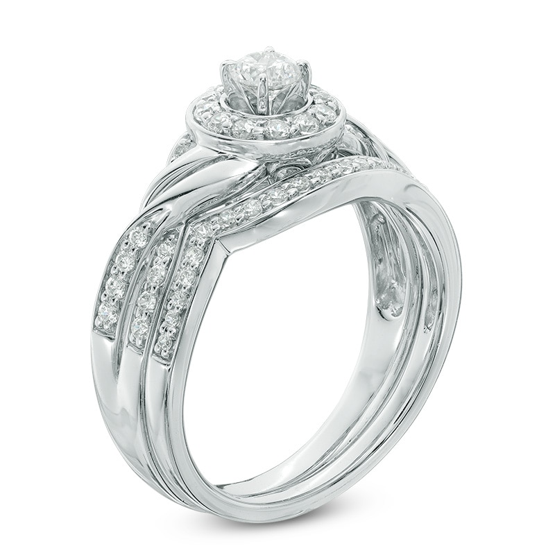 Main Image 2 of Previously Owned - 5/8 CT. T.W. Diamond Frame Twist Bridal Set in 10K White Gold
