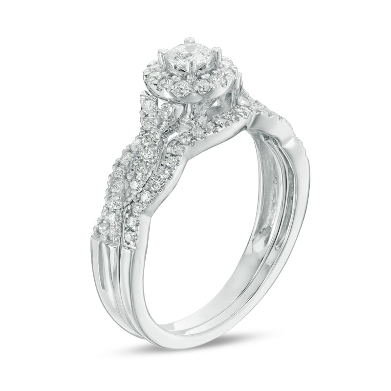 Main Image 2 of Previously Owned - 1/2 CT. T.W. Diamond Frame Twist Bridal Set in 10K White Gold
