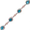 Thumbnail Image 1 of Previously Owned - London Blue Topaz and White Lab-Created Sapphire Bracelet in Sterling Silver with 14K Rose Gold Plate
