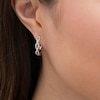 Thumbnail Image 1 of Previously Owned - 1/4 CT. T.W. Diamond Twist Hoop Earring in 10K White Gold