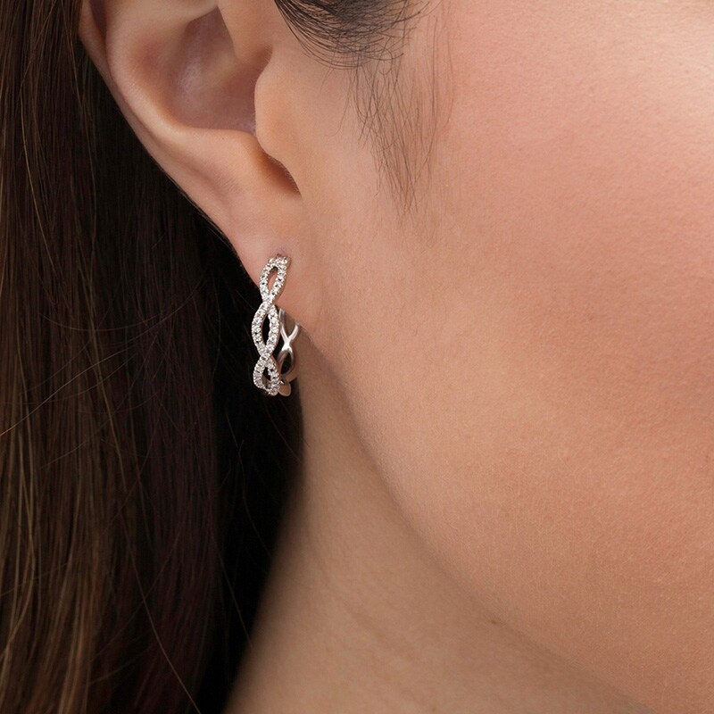 Previously Owned - 1/4 CT. T.W. Diamond Twist Hoop Earring in 10K White Gold