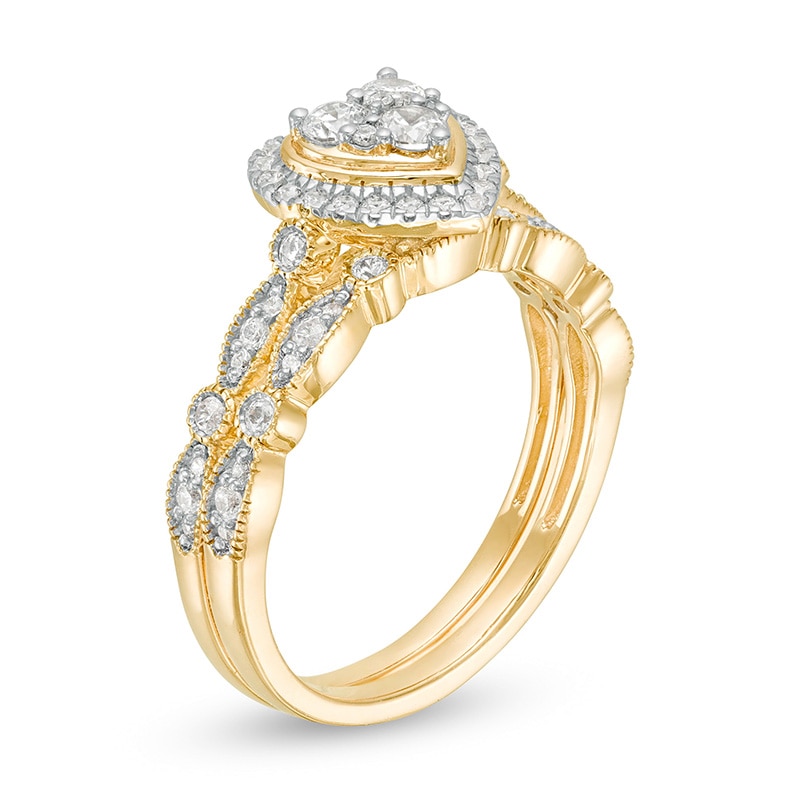 Previously Owned - 1/2 CT. T.W. Multi-Diamond Heart Frame Alternating Marquise Vintage-Style Bridal Set in 10K Gold