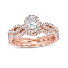 Previously Owned - 1 CT. T.W. Oval Diamond Frame Split Shank Bridal Set in 14K Rose Gold