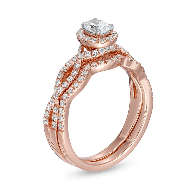 Main Image 3 of Previously Owned - 1 CT. T.W. Oval Diamond Frame Split Shank Bridal Set in 14K Rose Gold