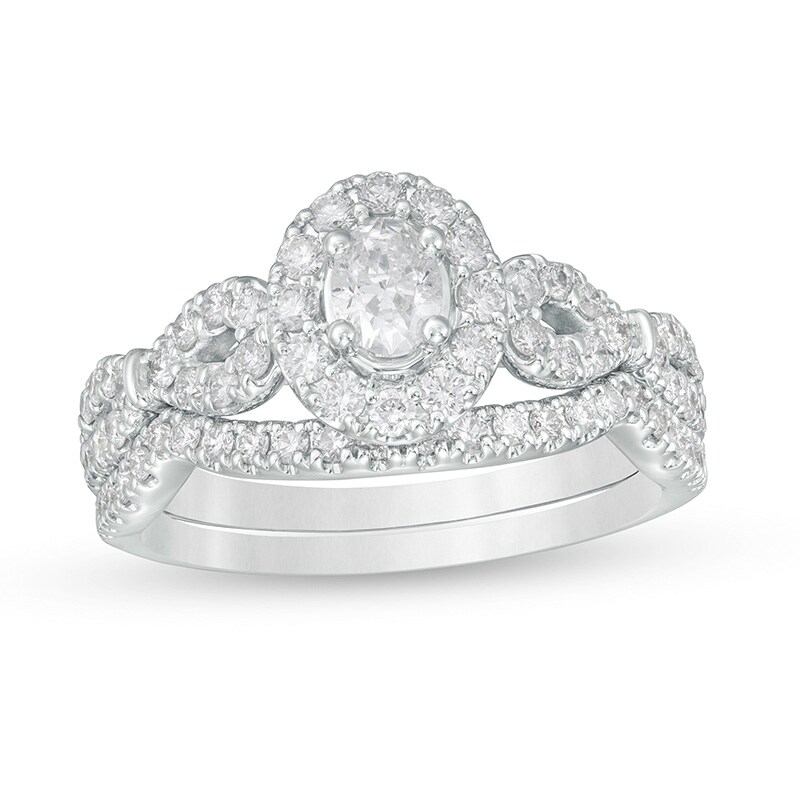 Main Image 1 of Previously Owned - 1 CT. T.W. Oval Diamond Frame Collar Bridal Set in 14K White Gold (I/I2)