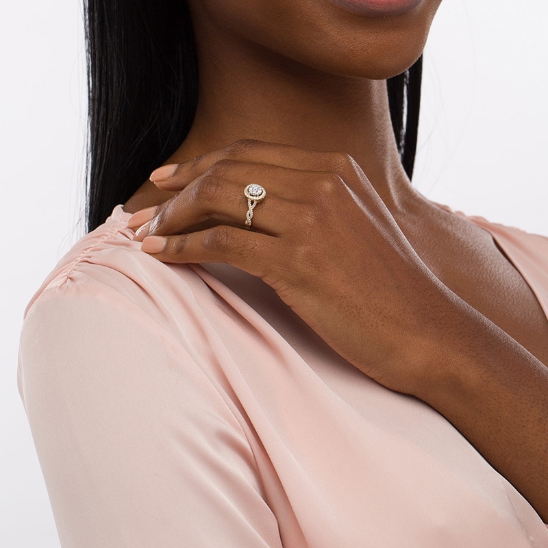 Main Image 2 of Previously Owned - 1/2 CT. T.W. Oval Multi-Diamond Frame Twist Shank Engagement Ring in 10K Gold