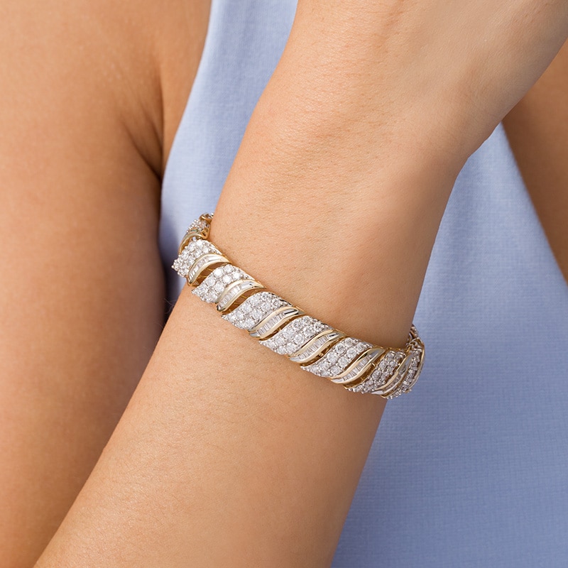 Main Image 2 of Previously Owned - 10 CT. T.W. Baguette and Round Diamond Wave Bracelet in 10K Gold