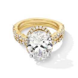 Previously Owned - 5 CT. T.W. Oval Lab-Grown Diamond Frame Alternating Shank Bridal Set in 14K Gold (F/VS2)